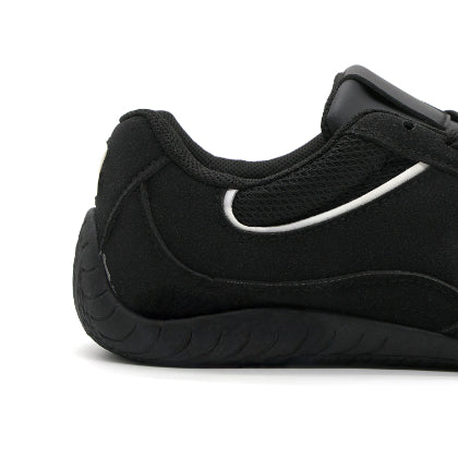 Black Retro Court Sneaker in Black – close-up of the heel and sole